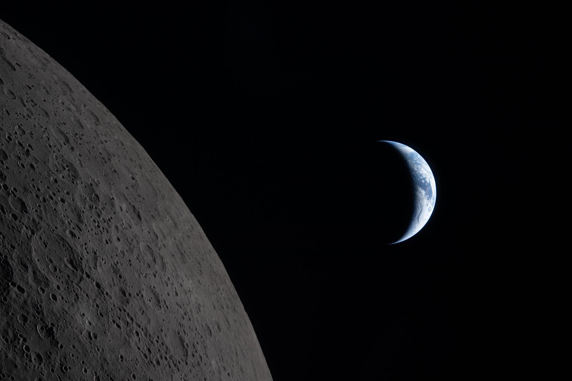 Earth rising above the moon