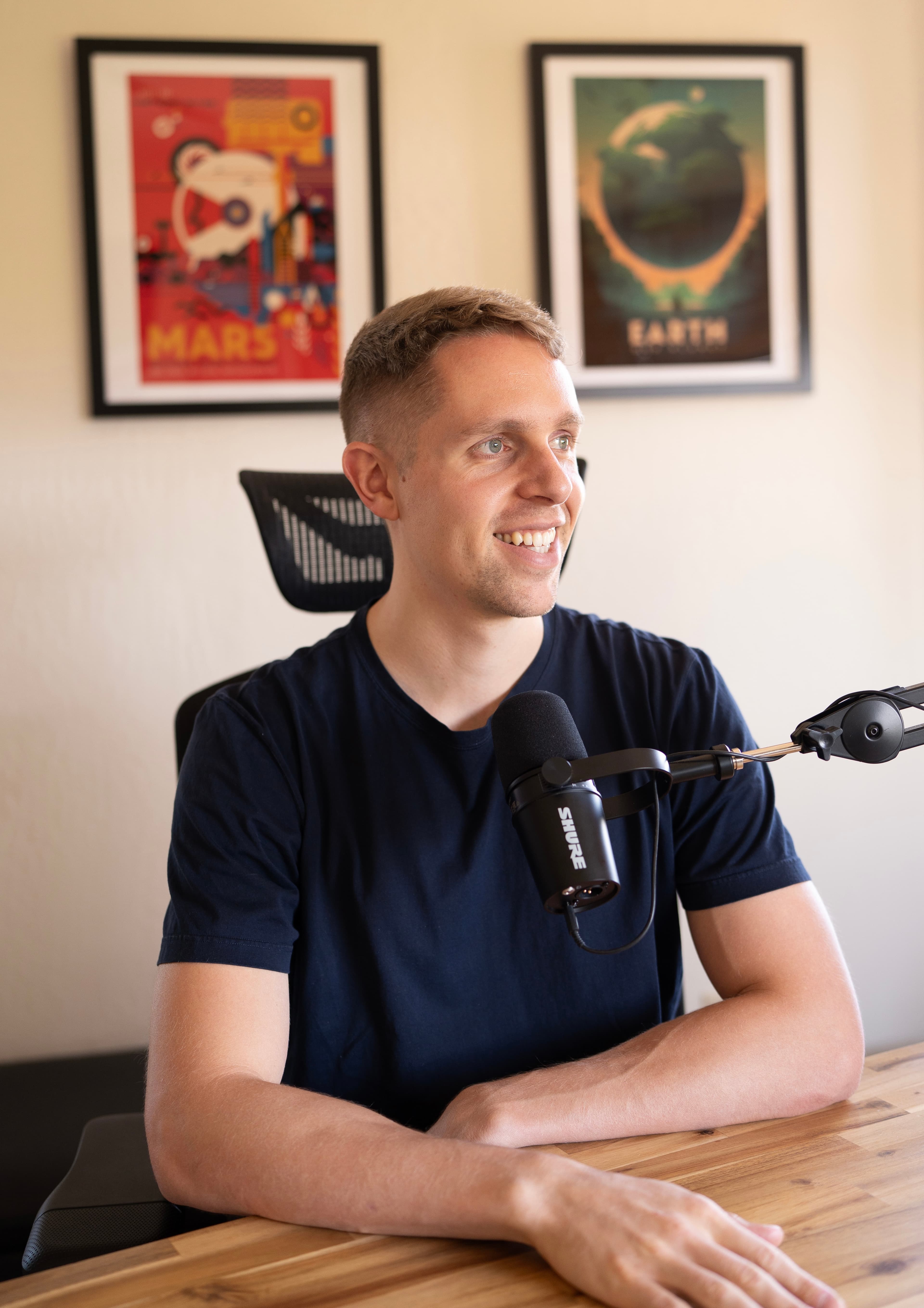 Ross Hoffman at a podcast microphone