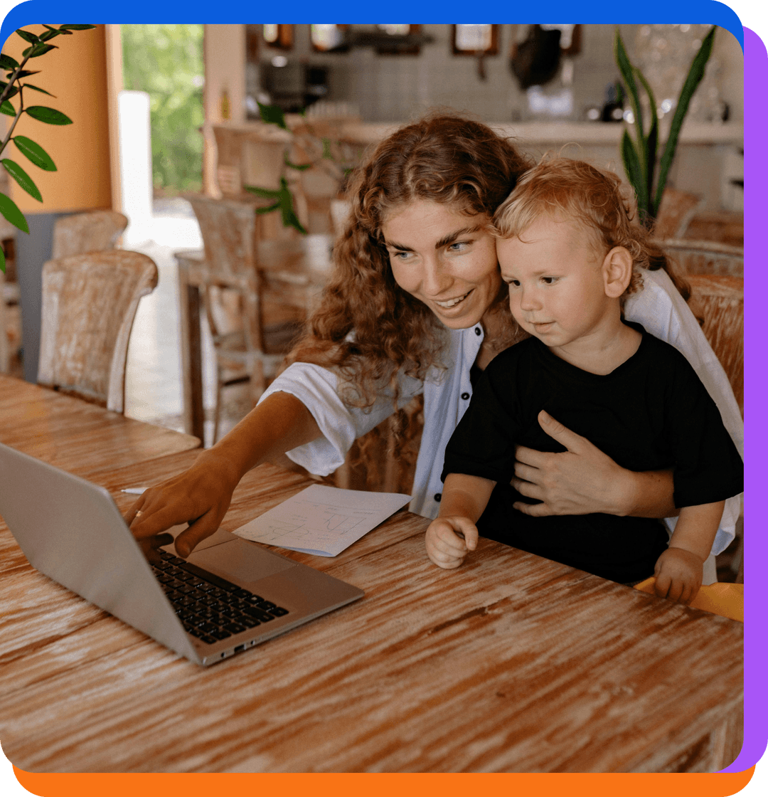 Mother and child looking at laptop